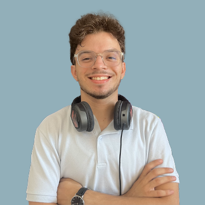 Yessine Akrout smiling, wearing glasses and headphones